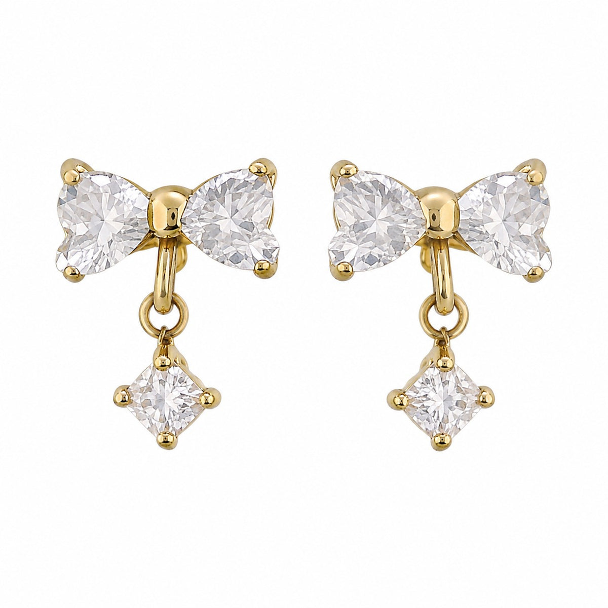 A pair of gold bow-shaped drop earrings with clear gemstones, shown on a plain white background.